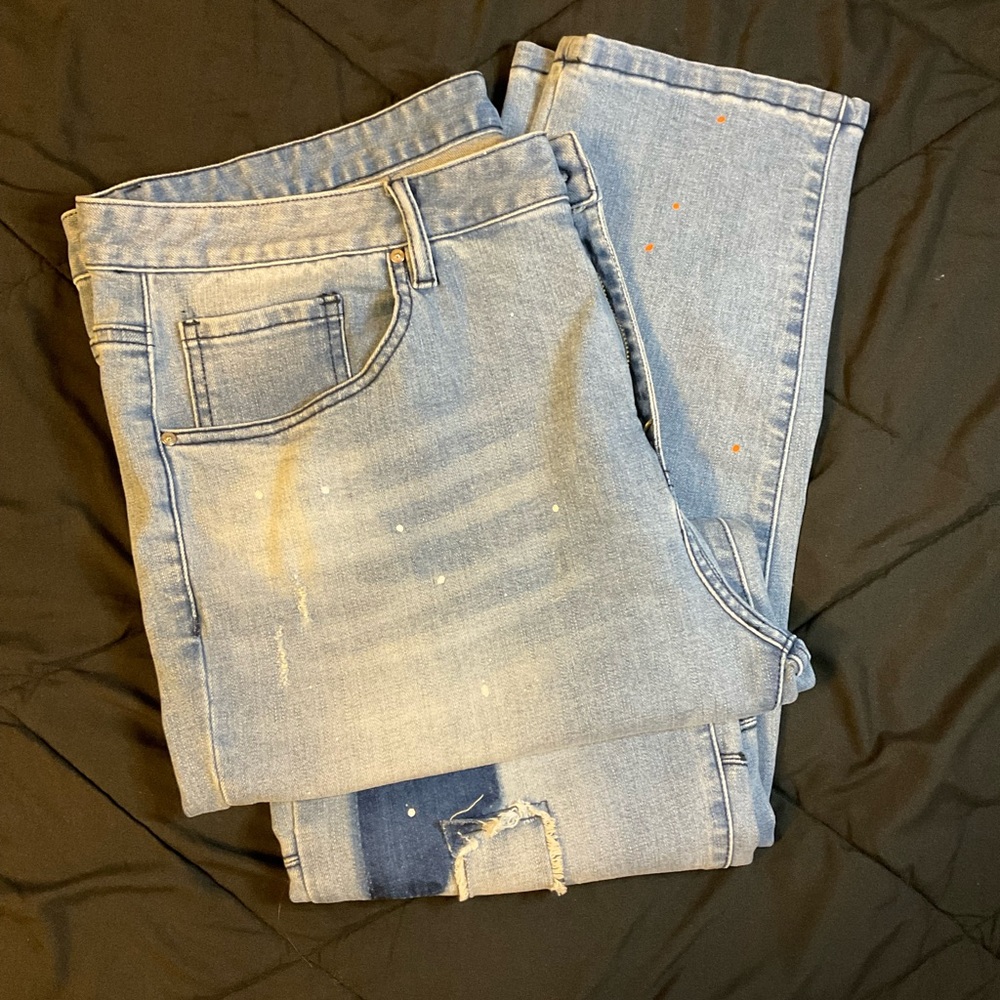 Blue skinny jeans with patch work and paint splatter